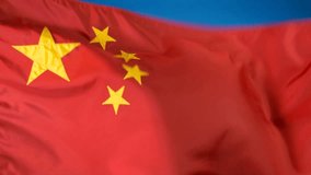 Close up of Chinese flag waving in the breeze