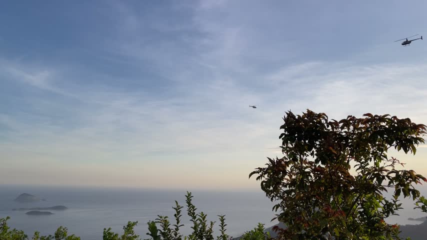 Helicopters flying over the ocean with a scenic view in Rio de Janeiro Brazil