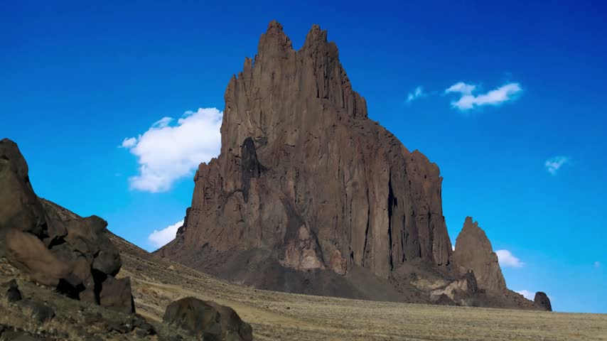 Shiprock, the great volcanic rock mountain in the desert plane of New Mexico, USA.Shiprock, the great volcanic rock mountain in desert plane of New Mexico, USAEstablishing shot of mountains with red rocks background in Slickrock Divide, Capitol Reef National Park, Utah, North America. Day time on . ProRes 422 HQ.Shiprock New Mexico Southwestern Desert Landscape, America, USA.