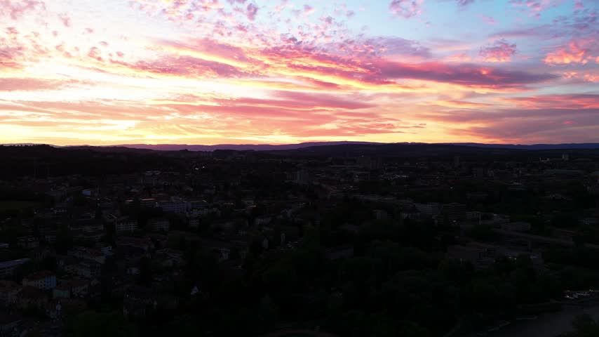 Fly sideways, view of Bern and Swiss landscape during sunset