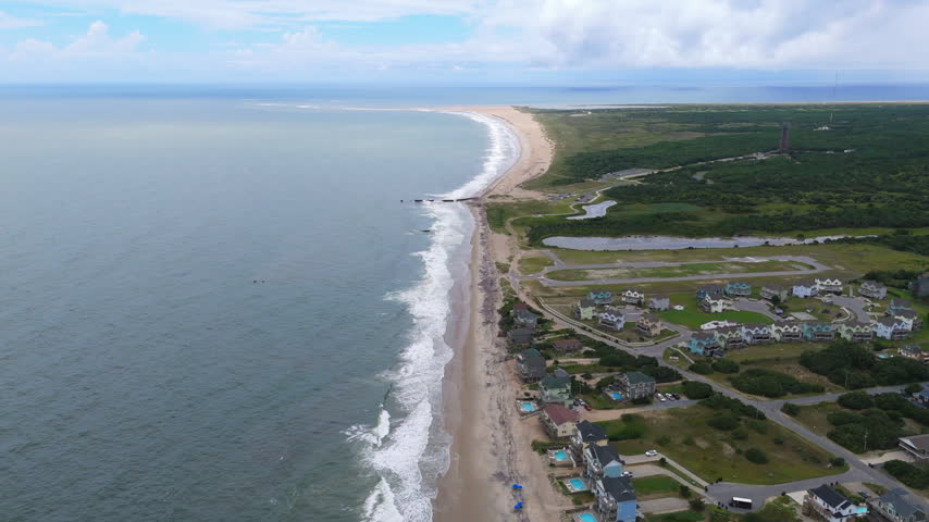 Private Property Surrounded By Coastal Landscape, Sandy Terrain And Vegetation On The Outer Banks In North Carolina, USA. Vertical, Aerial Shot