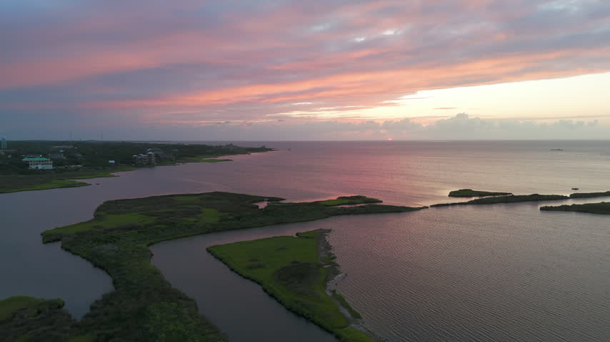Coastal Marshlands Across The Outer Banks Landscape Of North Carolina At Sunset In The United States. Aerial Shot