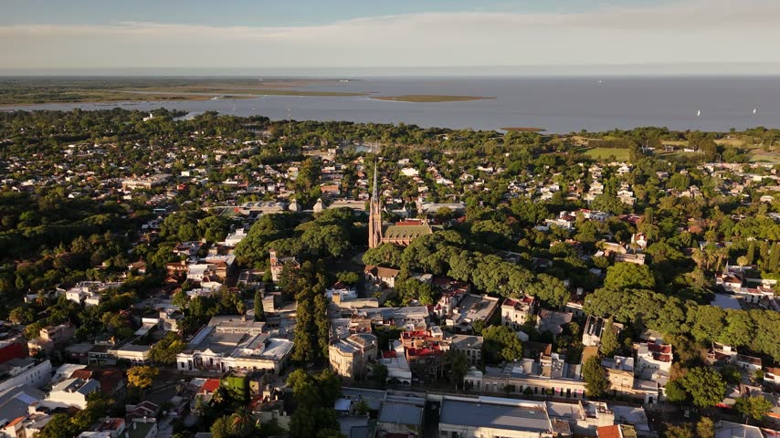 Panoramic aerial view of San Isidro town center with Cathedral spire and Rio de la Plata river in background