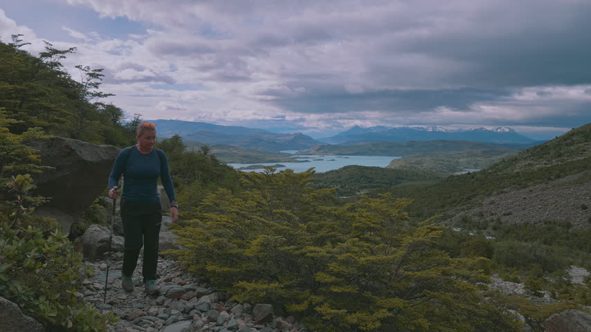 Female Hiker Walking on Rocky Mountain Trail in Torres del Paine National Park, Patagonia, Chile