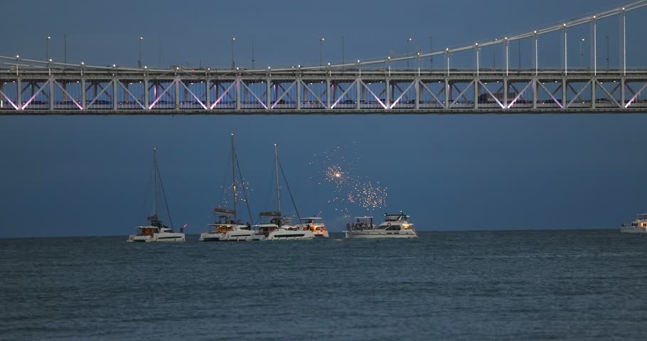 Gwangan Bridge (Gwangandaegyo), Diamond Bridge, Busan, South Korea, illuminated bridge at night in Gwangalli, Suyeong-gu, with fireworks launched from a yachts and boats, seen from Gwangalli Beach