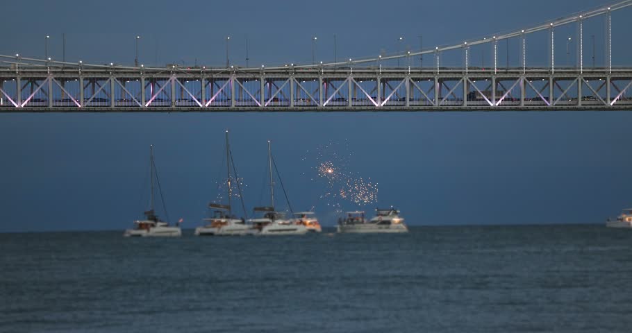Gwangan Bridge (Gwangandaegyo), Diamond Bridge, Busan, South Korea, illuminated bridge at night in Gwangalli, Suyeong-gu, with fireworks launched from a yachts and boats, seen from Gwangalli Beach