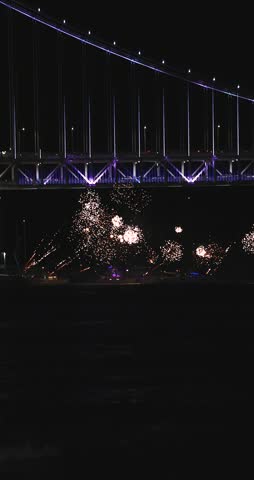 Gwangan Bridge (Gwangandaegyo), Diamond Bridge, Busan, South Korea, illuminated bridge at night in Gwangalli, Suyeong-gu, with fireworks launched from a yachts and boats, seen from Gwangalli Beach