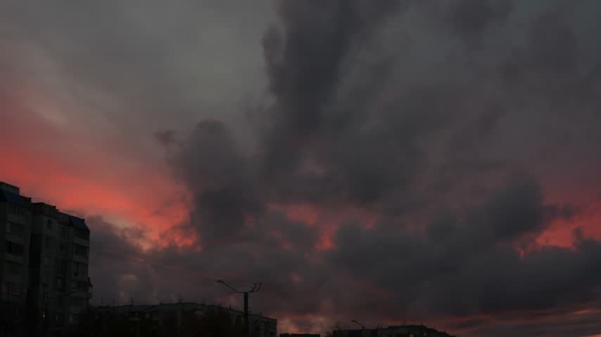 Dusk Sky with Pink Clouds Over Urban Buildings