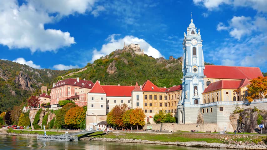 The medieval town of Durnstein along the Danube River in the picturesque Wachau Valley, a UNESCO World Heritage Site, in Lower AustriaDURNSTEIN, AUSTRIA -25 JULY 2015- The medieval town of Durnstein along the Danube River in the picturesque Wachau Valley, a UNESCO World Heritage Site, in Lower Austria.Timelapse of golden autumn in famous tourist landmark town Bad Tolz. Landscape view of Isar river, trees, town bridge, idyllic Bavarian houses and Church. Bad Toelz, Bavaria, Germany.