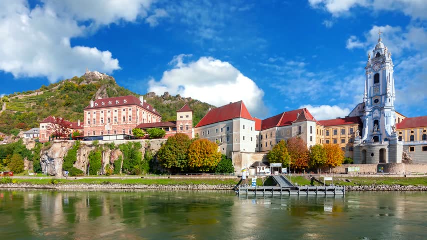 The medieval town of Durnstein along the Danube River in the picturesque Wachau Valley, a UNESCO World Heritage Site, in Lower AustriaDURNSTEIN, AUSTRIAThe medieval town of Durnstein along the Danube River in the picturesque Wachau Valley, a UNESCO World Heritage Site, in Lower Austria.Timelapse of golden autumn in famous tourist landmark town Bad Tolz. Landscape view of Isar river, trees, town bridge, idyllic Bavarian houses and Church. Bad Toelz, Bavaria, Germany.