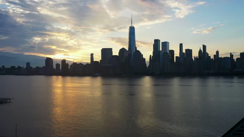 Aerial view of the Manhattan skyline at sunset over the Hudson River, Jersey City, New Jersey, United States.