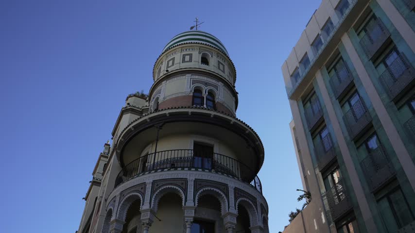 Clean architectural shot of historic Spanish building facade in Seville, Spain
