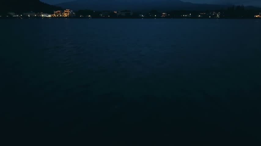 Dusk View of Snow-Capped Mount Fuji Over Calm Lake