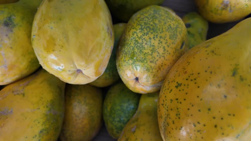 Ripe yellow papayas in a box at a farmers market, Hawaii