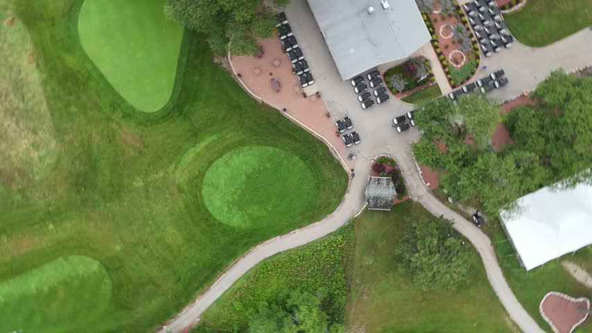 Aerial view of golf course putting greens and winding cart path. Filmed in River Grove, Illinois.