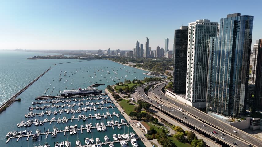 Aerial view of a Chicago lakefront marina and high rise towers. Filmed in Chicago, Illinois.