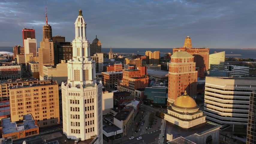 Aerial view of The Electric Tower at sunrise surrounded by historic buildings and urban architecture in Buffalo, New York, United States.