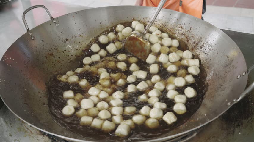 The chef is making fried glutinous rice balls