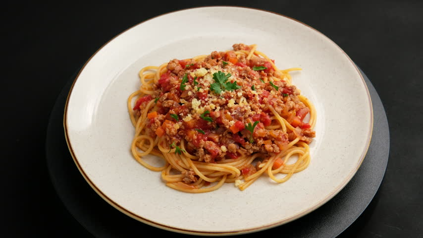 Spaghetti with minced pork in tomato sauce, pasta with a meat based bolognese tomatoes