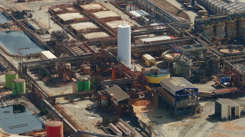 Aerial view of the Mina Cobre Las Cruces industrial facility featuring processing tanks, pipelines, and storage structures in Gerena, Andalucia, Spain.