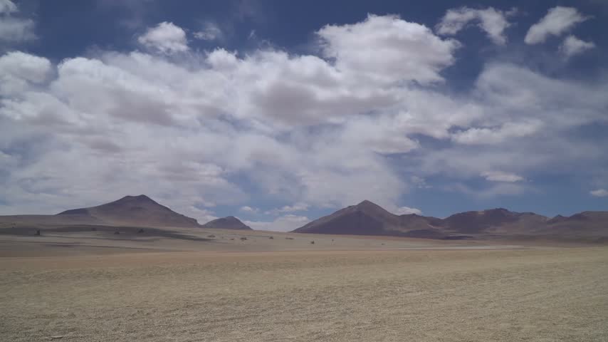 Atacama Desert Landscape With Mountains And Moving Clouds in Chile