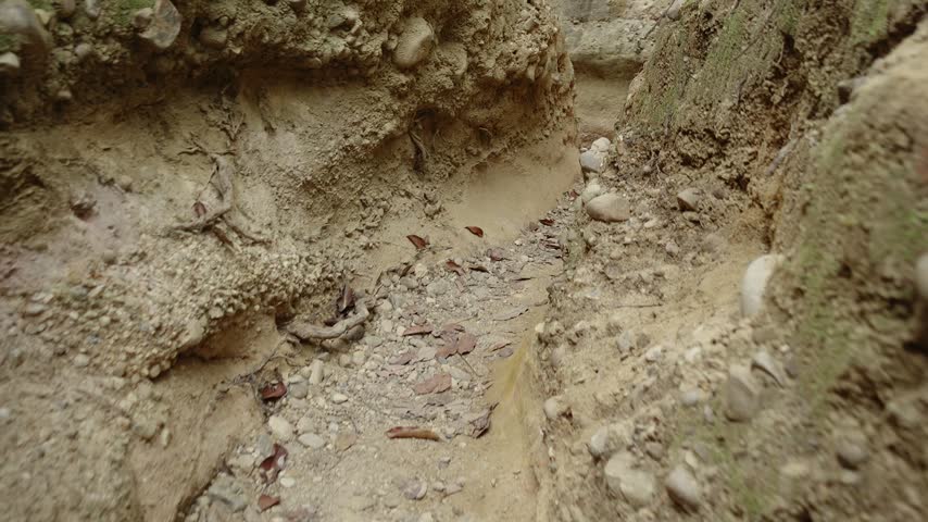 A channel eroded by water flowing from the mountains