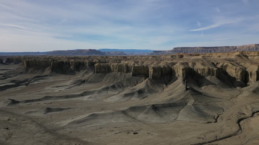 Aerial view of the rugged desert landscape and eroded rock formations near Hanksville, Utah, United States.