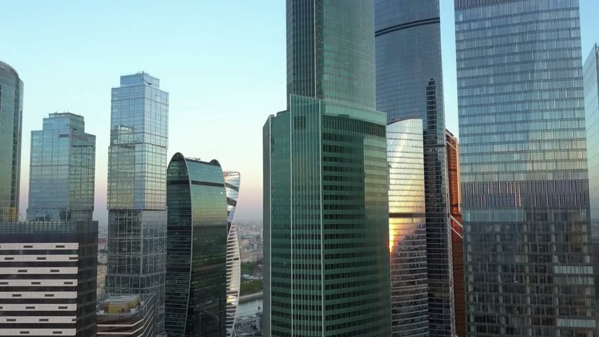 A spectacular aerial view of Moscow City, showcasing futuristic skyscrapers, modern architecture, and Russia’s impressive business district. The panoramic cityscape captures the energy and grandeur of Moscow’s urban skyline.