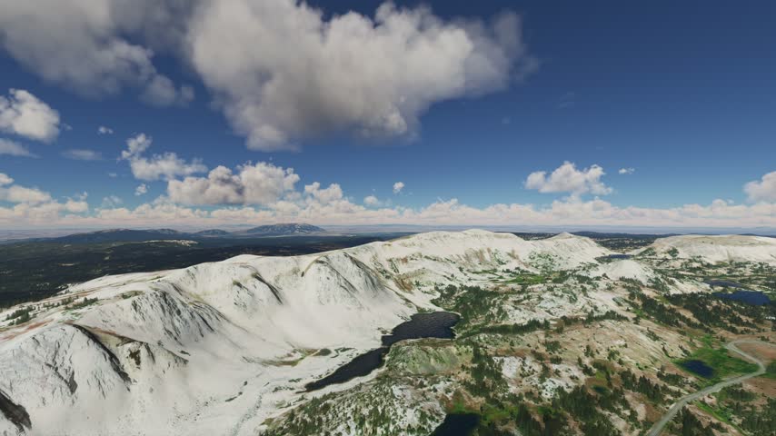 3D - Aerial shot of the snow in the Snowy Range and Lake Marie in the Medicine Bow Mountains. Wyoming. United States