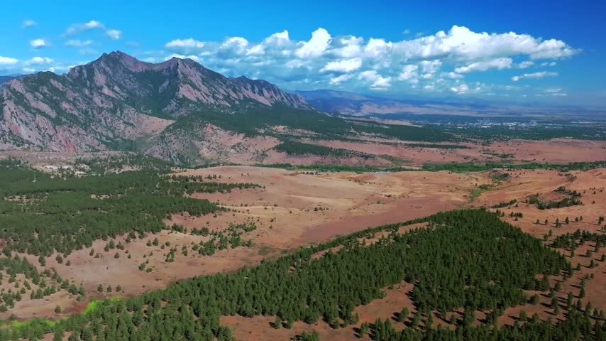 Aerial drone view City of Boulder vista The Flatirons South Boulder Colorado cityscape nature landscape summer fall autumn morning sunny blue sky Front Range Rocky Mountains Foothills circle right