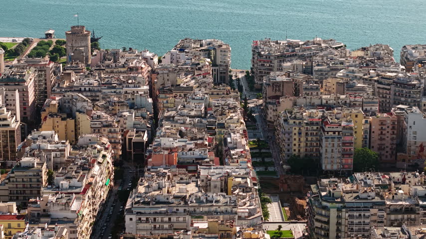 Thessaloniki, Greece. Drone View of Downtown Buildings, Streets and Old White Tower Landmark by Aegean Sea