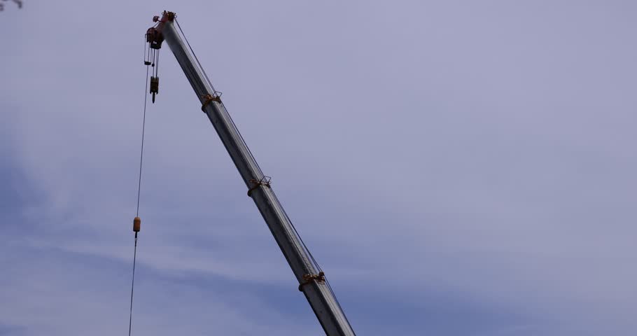 Moving tall cranes at the under construction in the public park cloudy day. High quality 4k footage. Nerima district Tokyo Japan 06.05.2023 Here is a downtown in Tokyo. 