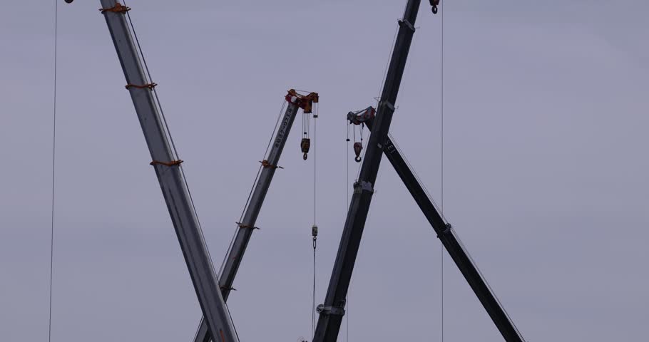Moving tall cranes at the under construction in the public park cloudy day. High quality 4k footage. Nerima district Tokyo Japan 06.05.2023 Here is a downtown in Tokyo. 
