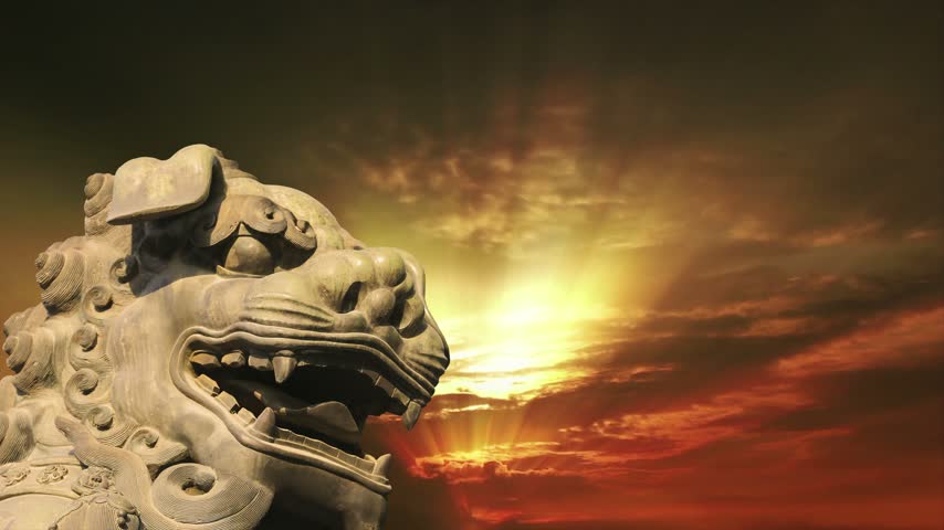 Bronze Guardian Lion Statue in Yonghe Temple (against the sunset), also known as the Palace of Peace and Harmony Lama Temple, the Yonghe Lamasery, or popularly the Lama Temple, is a temple of Tibetan Buddhism. Beijing, China. 4K, time lapse  
