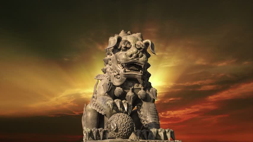 Bronze Guardian Lion Statue in Yonghe Temple (against the sunset), also known as the Palace of Peace and Harmony Lama Temple, the Yonghe Lamasery, or popularly the Lama Temple, is a temple of Tibetan Buddhism. Beijing, China. 4K, time lapse  