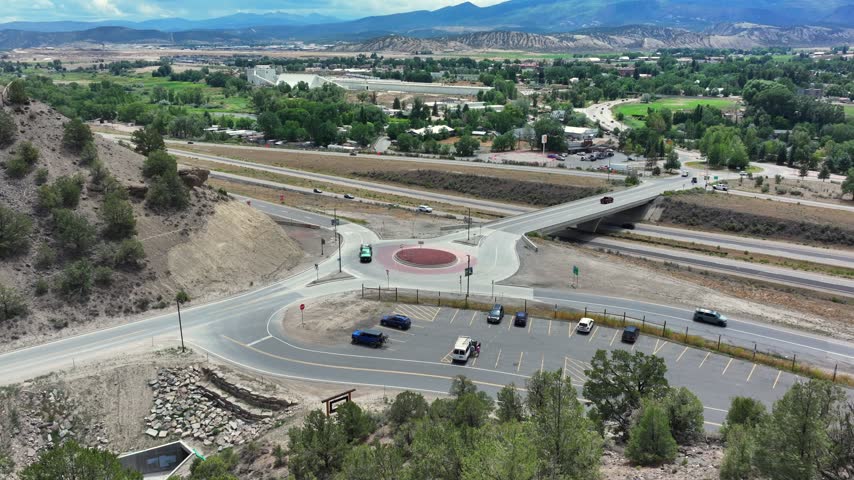 Aerial view of Interstate 70 North Ramp Roundabout with surrounding highway infrastructure and parking area in Gypsum, Colorado, United States.