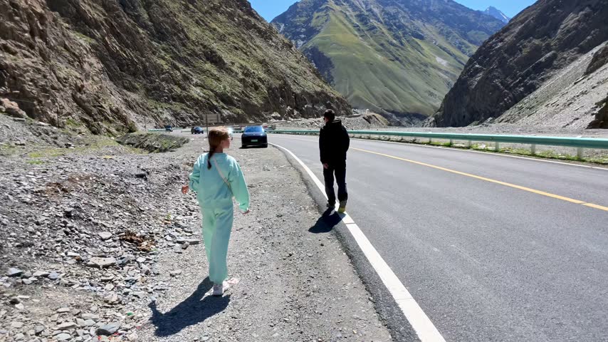 Duku Highway, Xinjiang Province, China, Asia - Two People on Highway