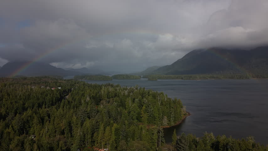 Drone shot of Rainbow over wilderness in Vancouver Island British Columbia