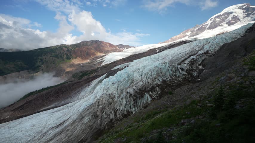 Pan up glacier to Mount Baker