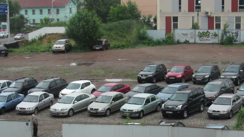UFA, RUSSIA - JUNE 14, 2013: Timelapse with many cars coming to parking in Ufa,