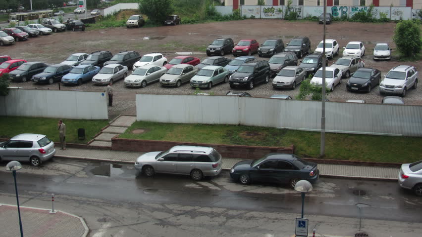 UFA, RUSSIA - JUNE 14, 2013: Timelapse with many cars coming to parking in Ufa,
