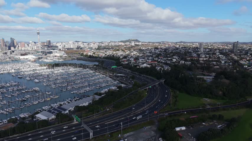 Aerial Drone Shot of Auckland Harbor and City Skyline with Sky Tower and Boats, New Zealand