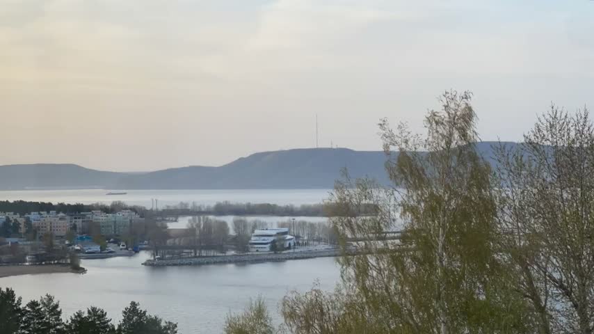Sunrise above the river and mountains