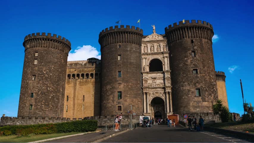 Naples, Italy Majestic view of Castel Nuovo often called Maschio Angioino, a medieval castle located on the seafront. It was a royal seat for the kings of Naples and Aragon.NAPLES ITALY  Castel Nuovo (New) or Maschio Angioino is a medieval castle located in front of Piazza Municipio and the city hall (Palazzo San Giacomo) in central Naples, Napoli, Italy : Royal  Nuov often called Maschio Angioino ("Angevin Keep"), is a medieval castle located in front of Piazza Municipio in centre of Napoli
