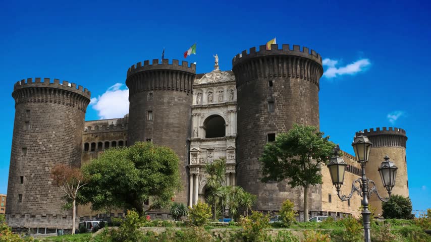 Naples, Italy Majestic view of Castel Nuovo often called Maschio Angioino, a medieval castle located on the seafront. It was a royal seat for the kings of Naples and Aragon.NAPLES ITALY  Castel Nuovo (New Castle) or Maschio Angioino is a medieval castle located in front of Piazza Municipio and the city hall (Palazzo San Giacomo) in central Naples, Napoli, Italy 10.28.2017: Nuovo  often called Maschio Angioino ("Angevin Keep"), is a medieval located in front of Piazza Municipio in centre of Napoli