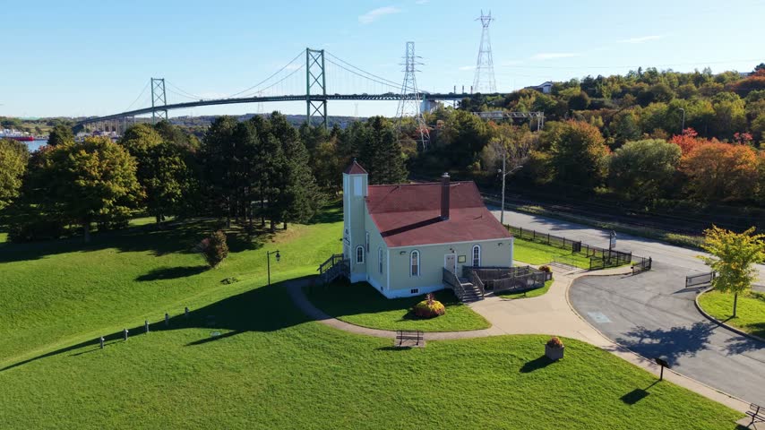 An aerial view holds over Africville Museum in Halifax, Nova Scotia, where a quiet lawn and historic building honor the painful history of the African Nova Scotian community.