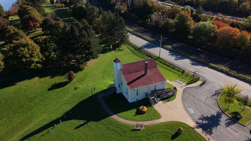 An aerial view circles the Africville Museum in Halifax, Nova Scotia, where the quiet grounds honor the painful history and enduring legacy of an African Nova Scotian community.