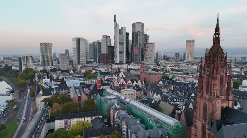 Aerial view of the Frankfurt skyline with the historic cathedral in the foreground and modern skyscrapers in the background in Frankfurt am Main, Hessen, Germany.