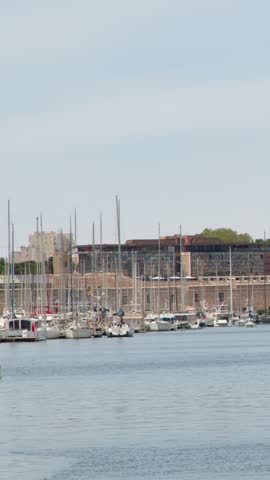Rows of sailboats rest peacefully in the harbor basin of Vieux Port in Marseille.