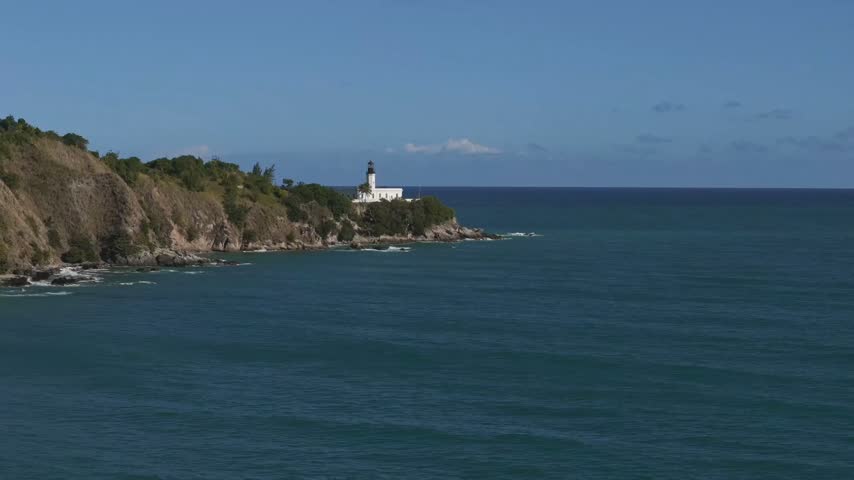 Puerto Rico Coastal Lighthouse on Rocky Cliff Above Caribbean Sea